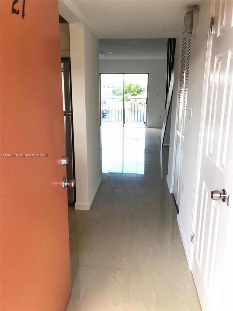 1100 West 35th Street, Unit 27 Hialeah, FL 33012 - Photo 3 of 24 a view of a room with a large window