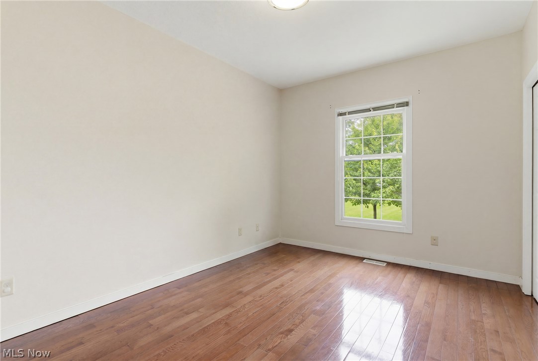 11678 Dunham Road Northfield, OH 44067 - Photo 13 of 38 Room with wood-finish flooring, neutral wall tones, and white trim