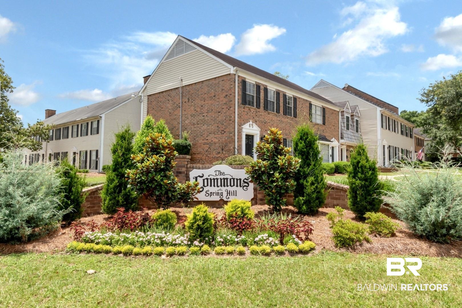 110 Du Rhu Drive, Unit E Mobile, AL 36608 - Photo 2 of 19 Community sign featuring a lawn
