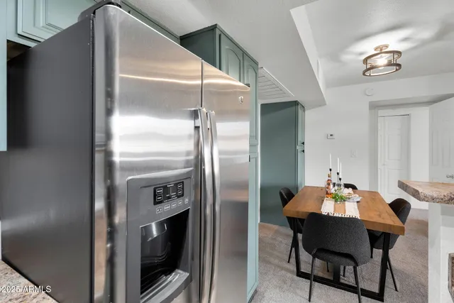 a stove top oven sitting inside of a kitchen