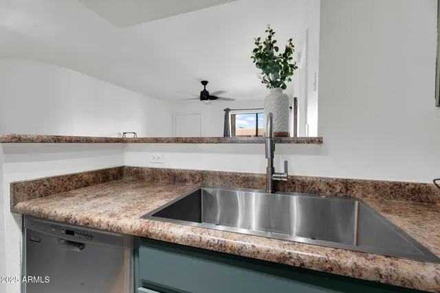 a dining room with furniture and chandelier