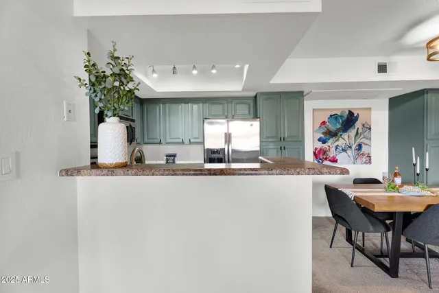 a view white cabinets and sink
