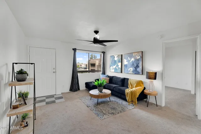 a living room with furniture and a large window