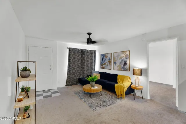 a living room with furniture and a window