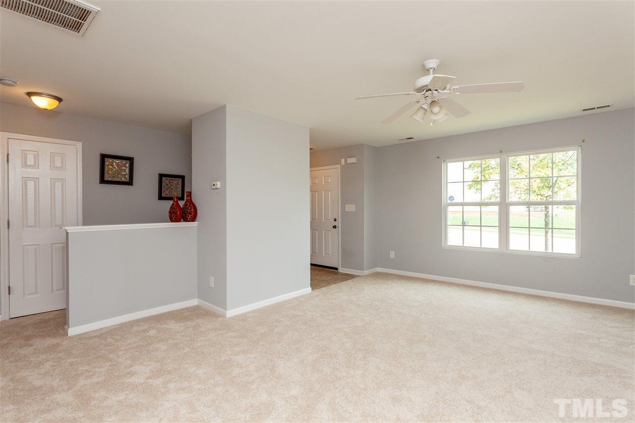 1408 Ricochet Drive Raleigh, NC 27610 - Photo 8 of 25 a view of a room with window and ceiling fan