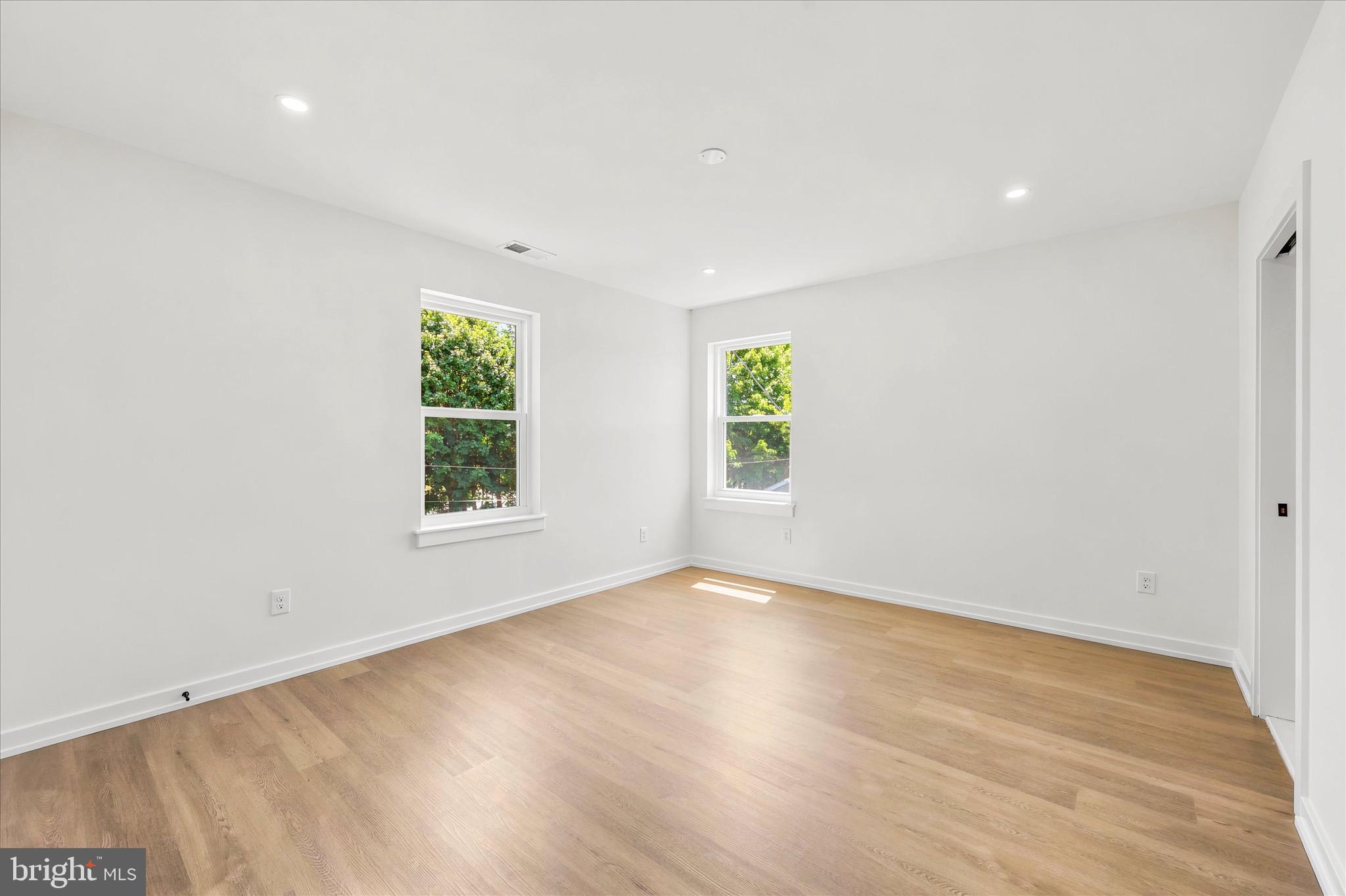 8 James Road Broomall, PA 19008 - Photo 22 of 35 wooden floor in an empty room with a window