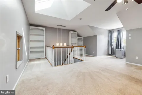 a view of a hallway with stairs and stairs