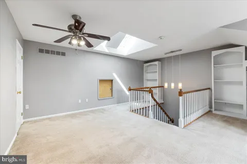 a view of a livingroom with a ceiling fan