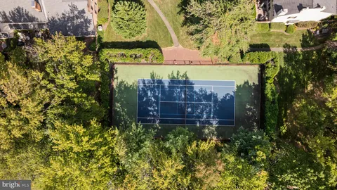 a view of a large garden with a building in the background