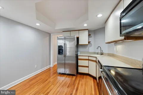 a kitchen with stainless steel appliances a refrigerator and a sink