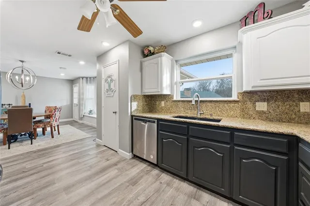 a spacious bedroom with a bed and a couch