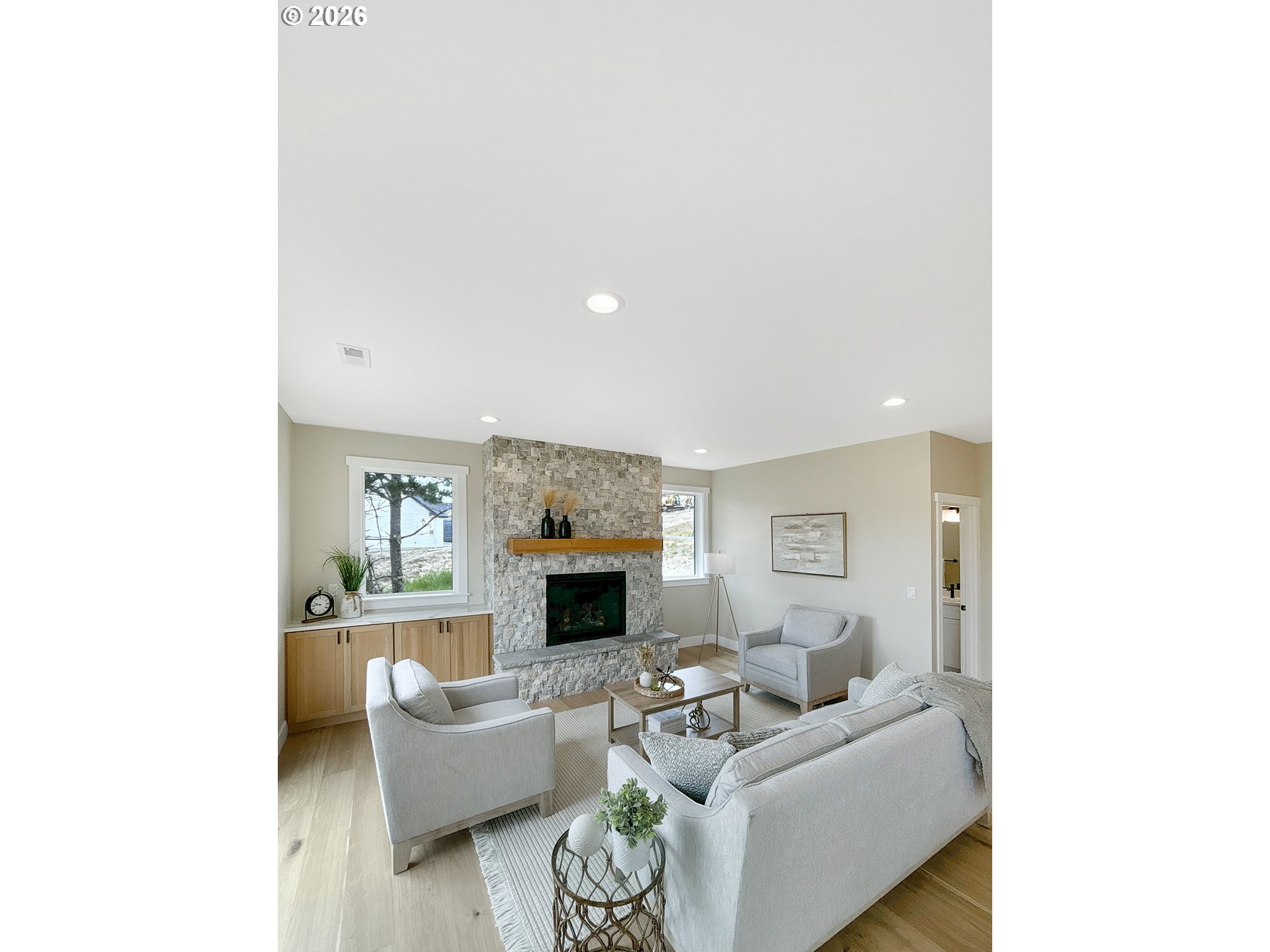 466 Meadows Drive Nehalem, OR 97131 - Photo 12 of 28 a living room with furniture and a flat screen tv