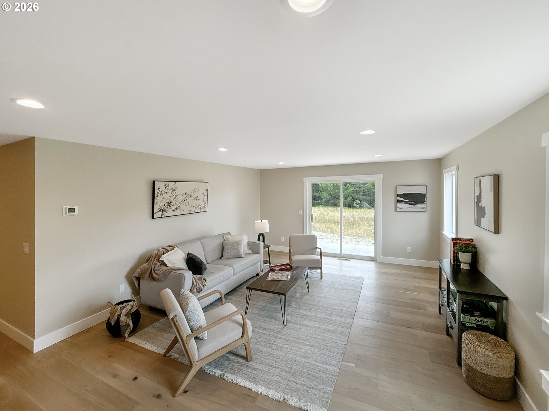 466 Meadows Drive Nehalem, OR 97131 - Photo 17 of 28 a living room with furniture window and wooden floor