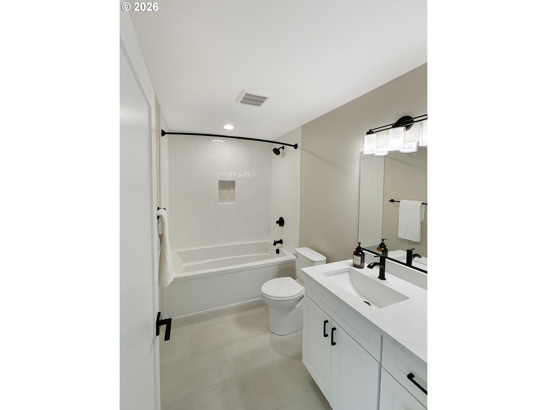 466 Meadows Drive Nehalem, OR 97131 - Photo 19 of 28 a bathroom with a double vanity sink toilet mirror and shower