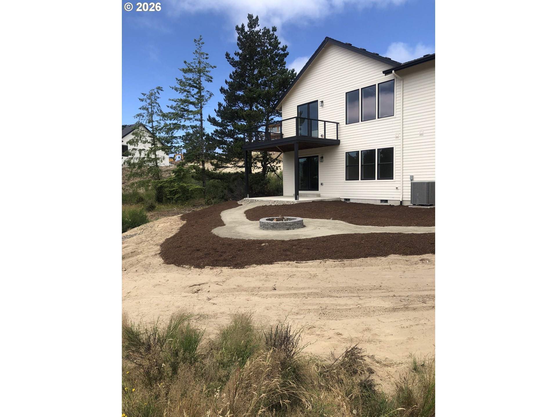 466 Meadows Drive Nehalem, OR 97131 - Photo 24 of 28 a white house that has tree in front of it
