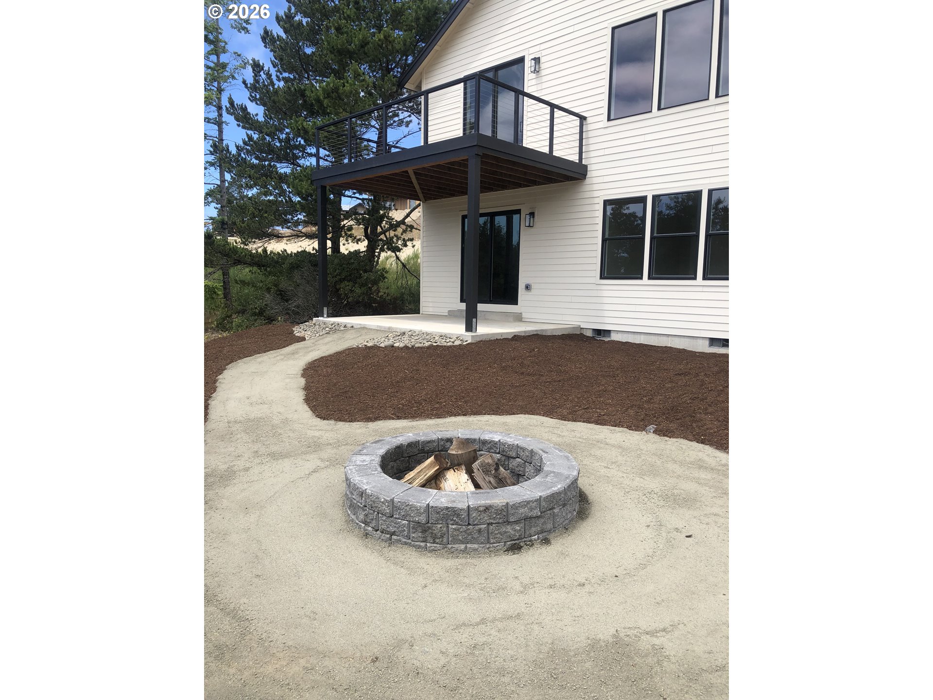 466 Meadows Drive Nehalem, OR 97131 - Photo 26 of 28 a view of a house with a yard