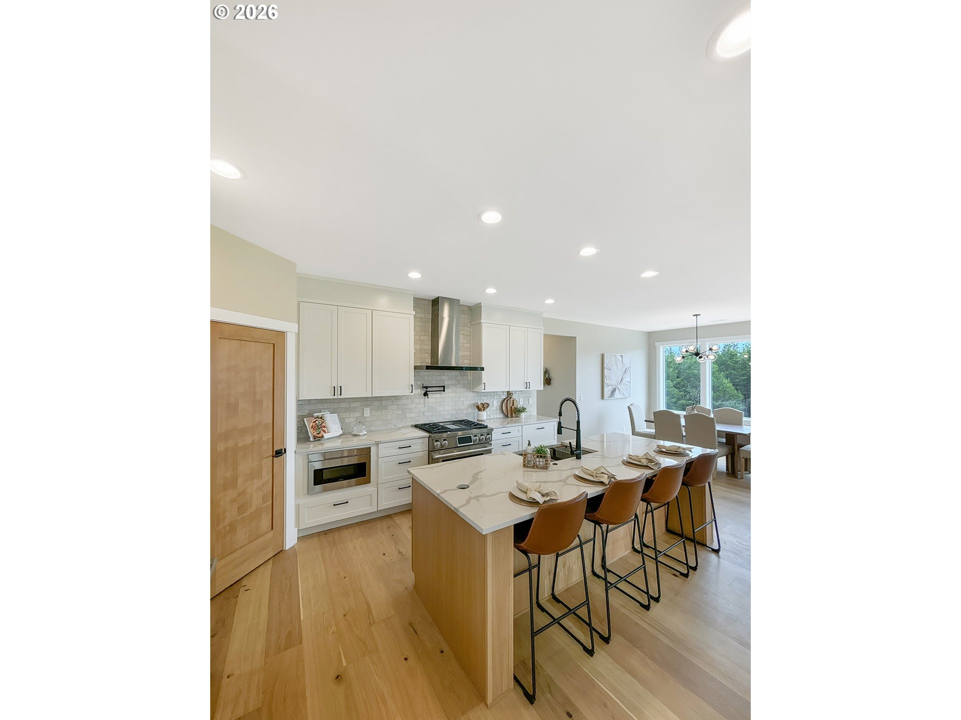 466 Meadows Drive Nehalem, OR 97131 - Photo 9 of 28 a view of a dining room with furniture and wooden floor