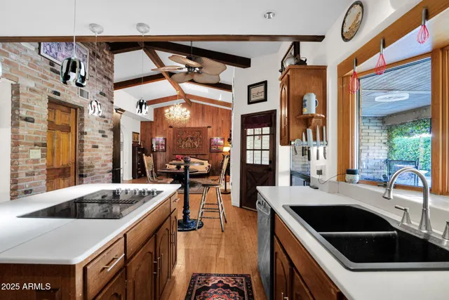 a kitchen that has a sink and a stove
