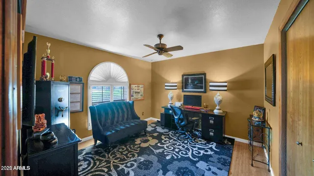a living room with furniture fireplace and a flat screen tv