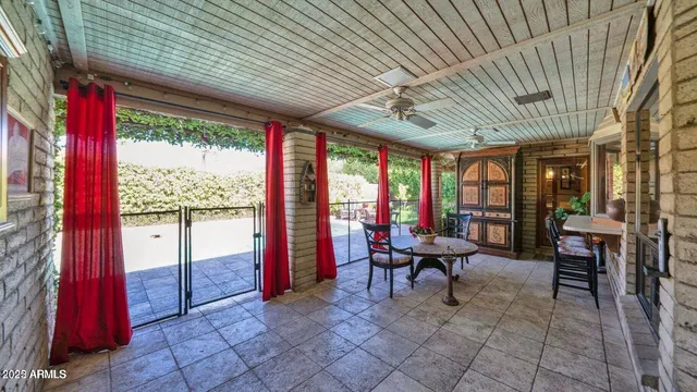 a view of a porch with chairs in front of a house