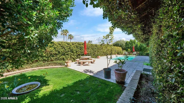 a view of a table and chairs in the garden