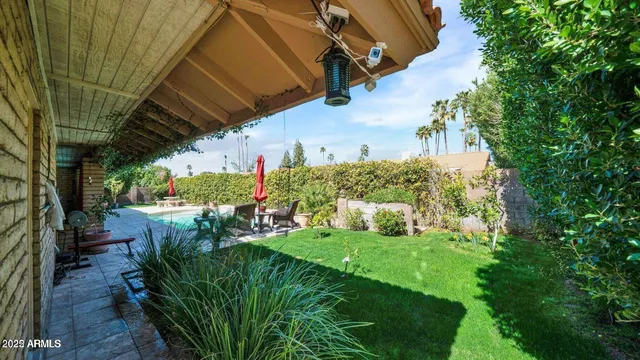 a view of yard with patio