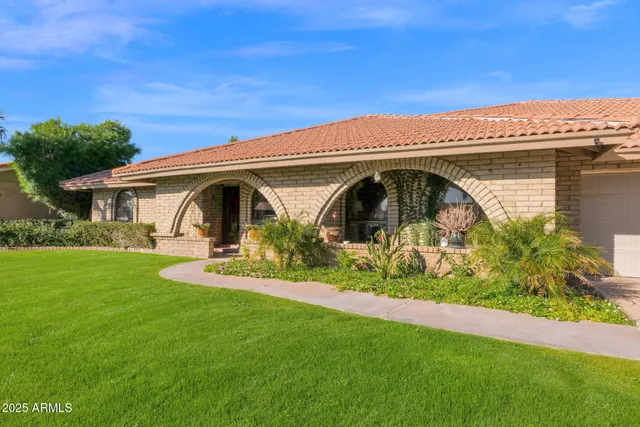 a front view of a house with garden
