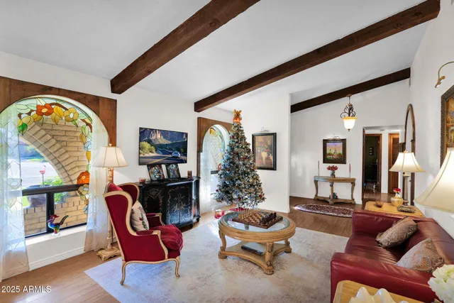 a living room with furniture a rug and a fireplace
