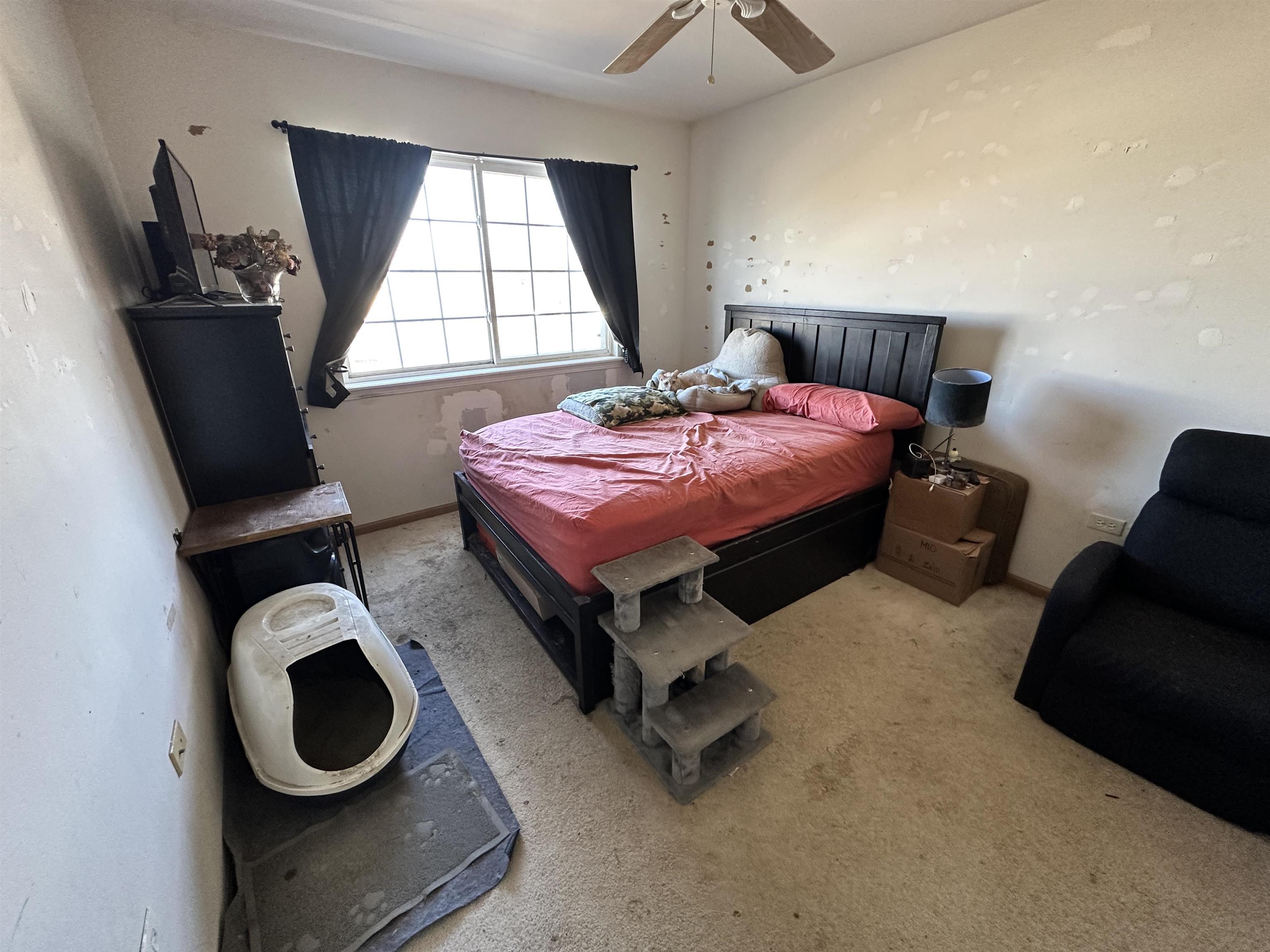 47 D Rolling Oaks Road Sugar Grove, IL 60554 - Photo 21 of 23 a spacious bedroom with a bed and window