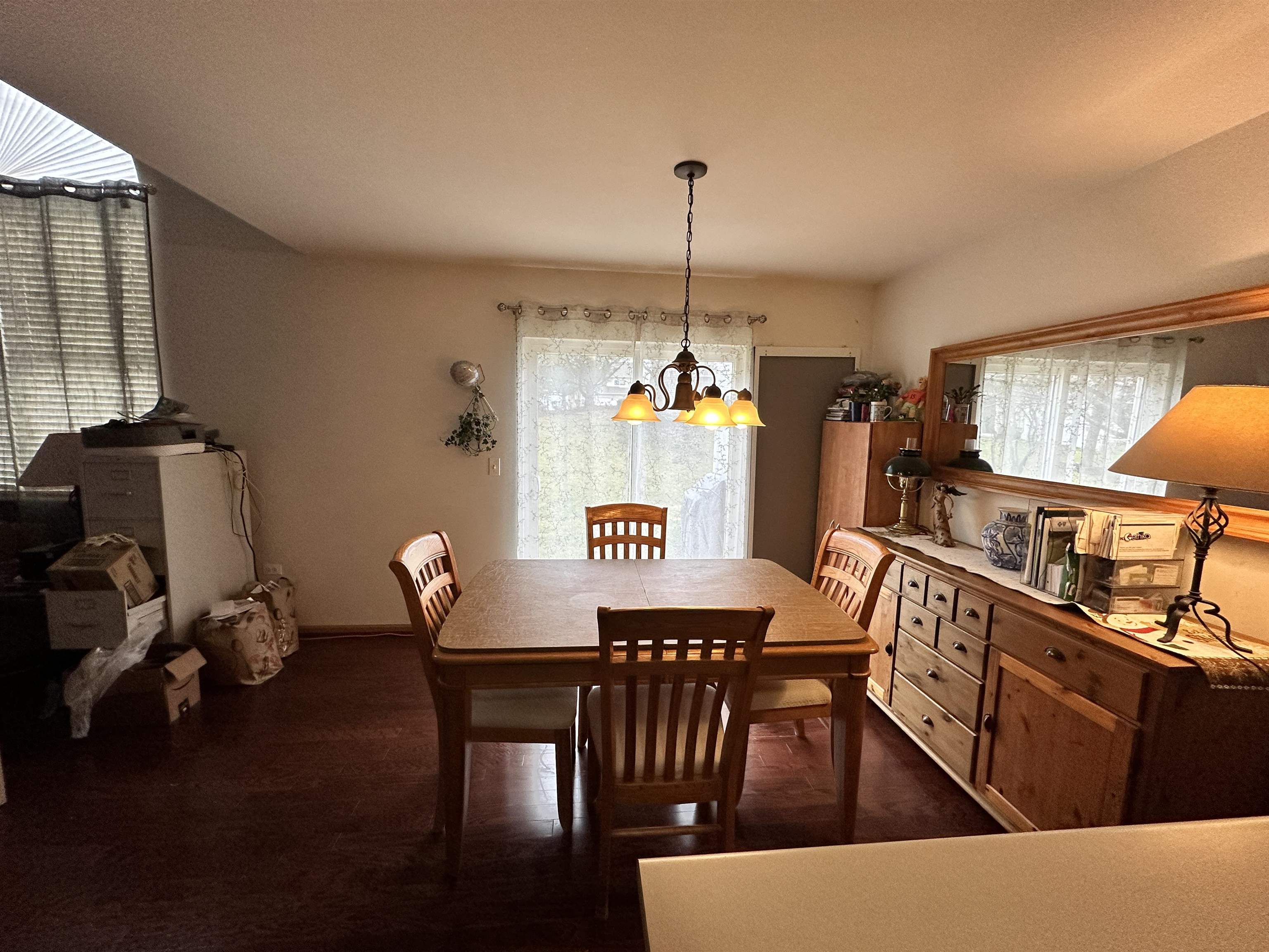 47 D Rolling Oaks Road Sugar Grove, IL 60554 - Photo 8 of 23 a dining room with furniture a chandelier and wooden floor
