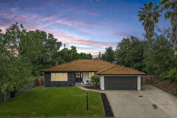 front view of a house with a yard