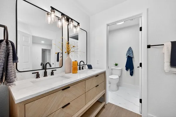 a bathroom with a sink and mirror