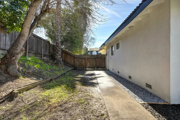 a swimming pool with outdoor seating and yard