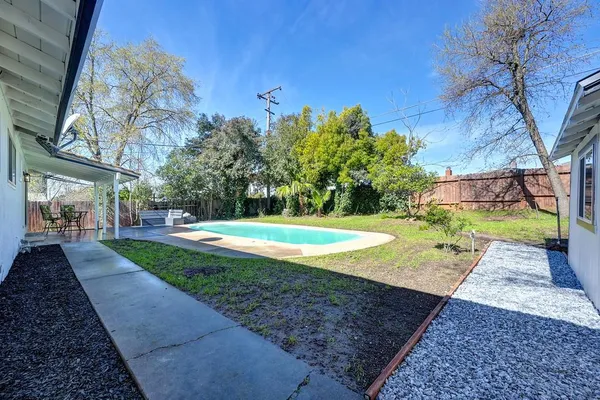a view of swimming pool with a patio