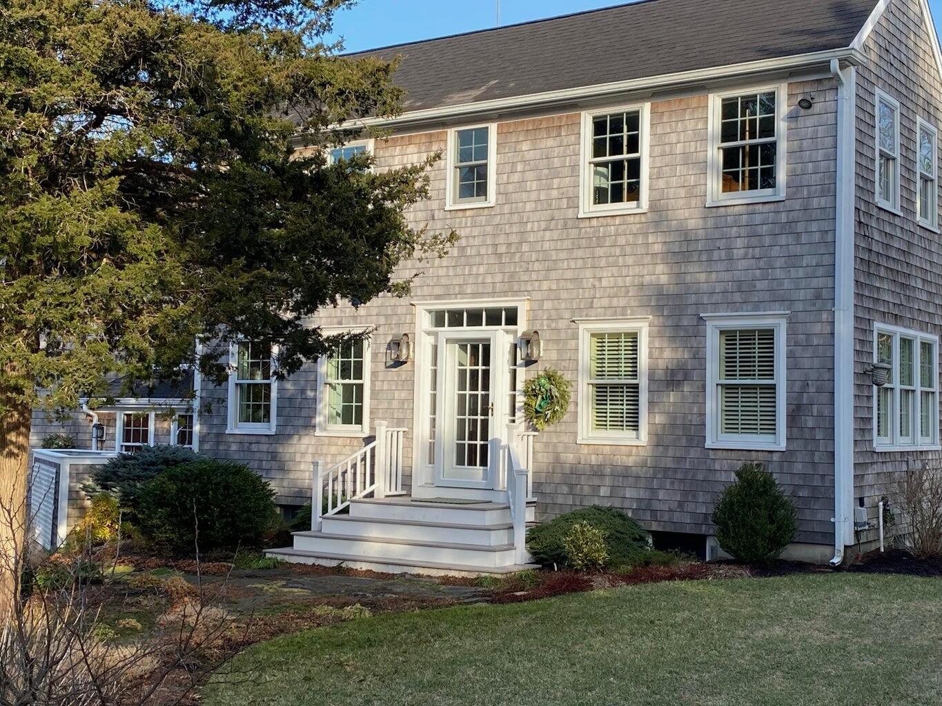 370 Tonset Road Orleans, MA 02653 - Photo 4 of 36 a front view of a house with a yard