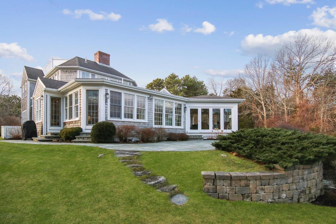 370 Tonset Road Orleans, MA 02653 - Photo 8 of 36 a front view of a house with a garden