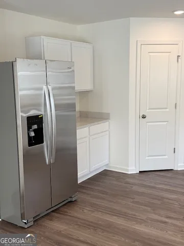 a kitchen with metallic refrigerator freezer and a dishwasher