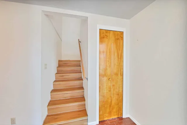 a view of a livingroom with furniture and hardwood floor