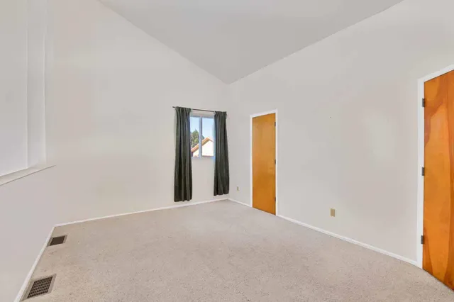 a bathroom with a shower and a glass door shower