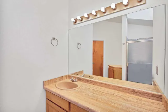 an empty room with a workspace and wooden floor
