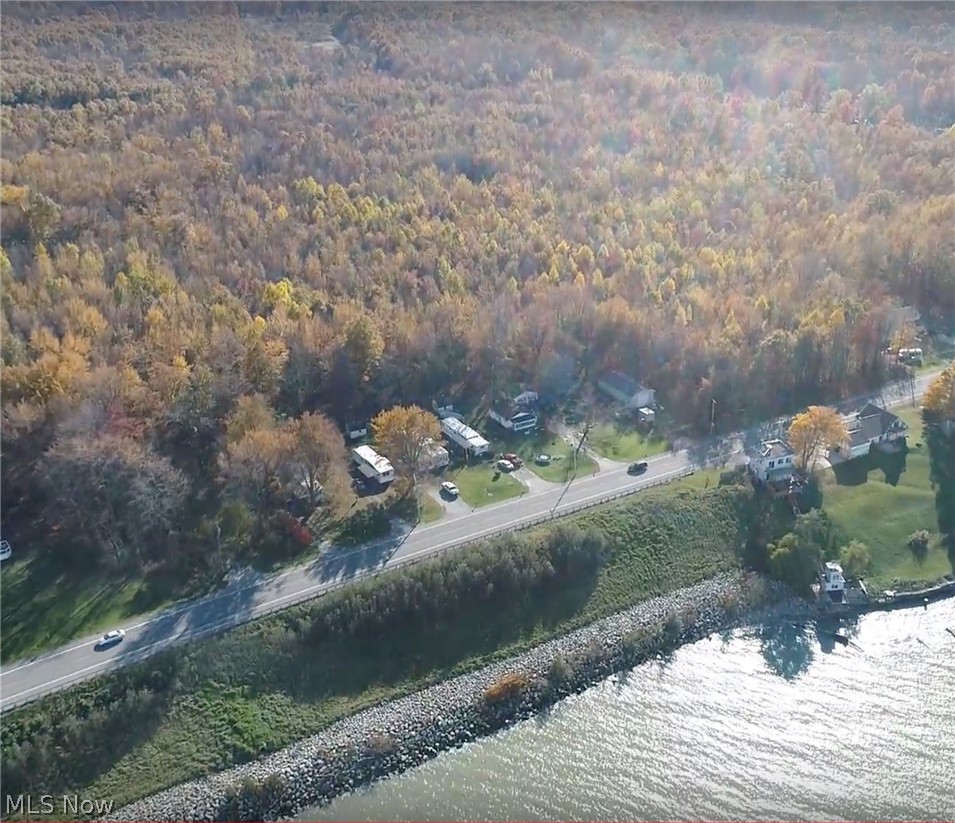 4141 North Bend Road Ashtabula, OH 44004 - Photo 9 of 17 View south from Lake Erie. Uncleared land on right side is the 2 additional parcels, uncleared land on left side is part of 90 acre parcel. 3 parcels included in sale.