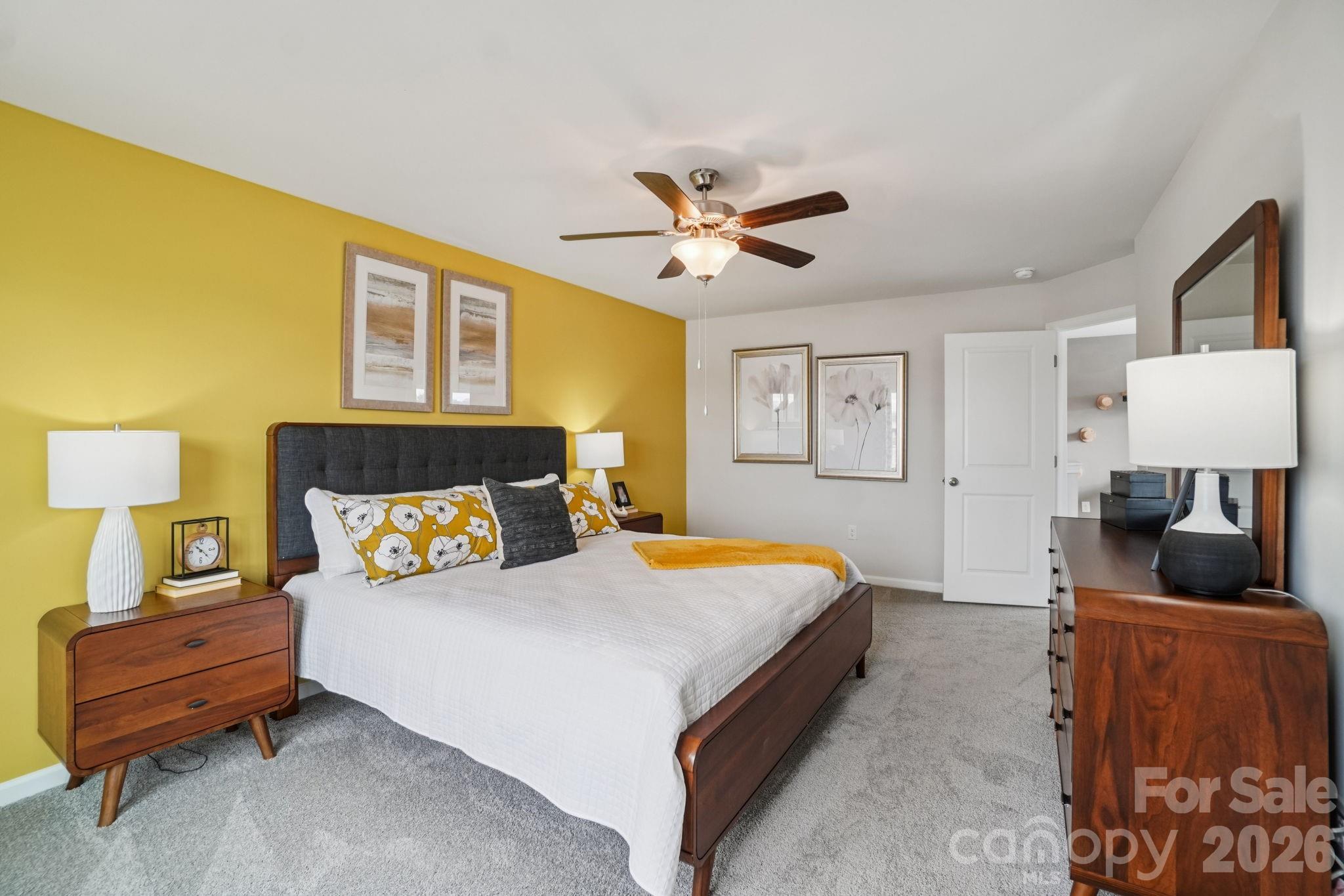 362 Lagoon Road Fletcher, NC 28732 - Photo 19 of 34 a bedroom with a bed and wooden floor