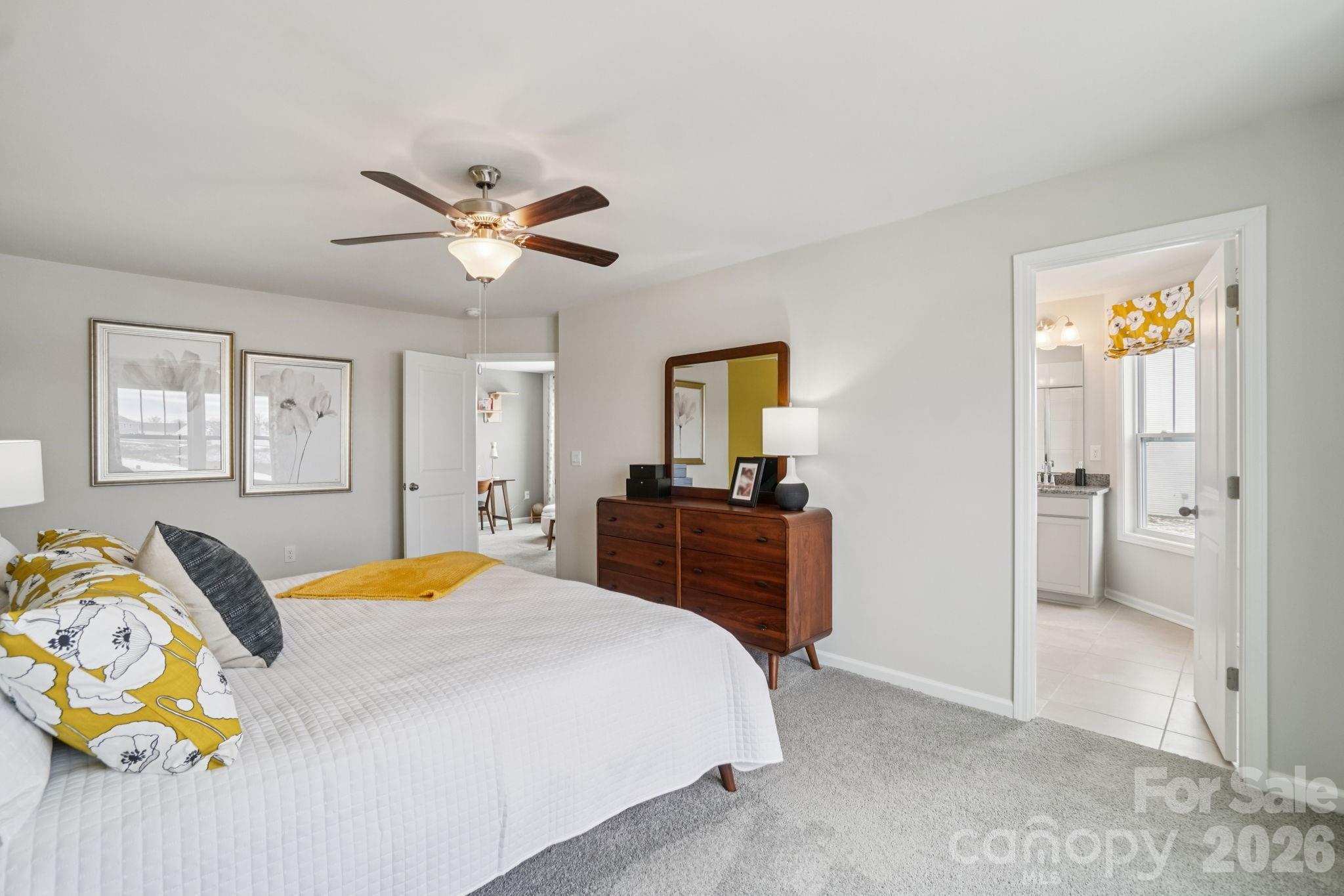 362 Lagoon Road Fletcher, NC 28732 - Photo 20 of 34 a bedroom with a bed and a chandelier