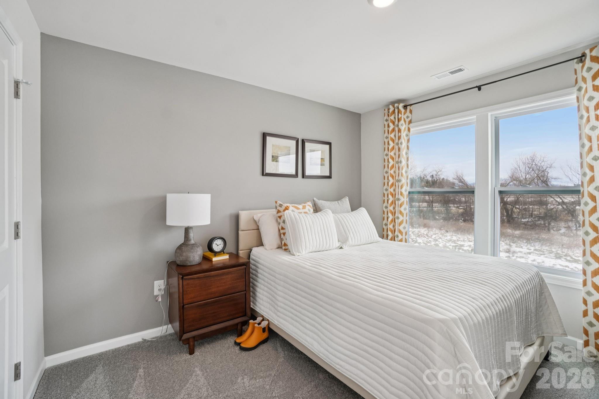 362 Lagoon Road Fletcher, NC 28732 - Photo 26 of 34 a bedroom with a bed and window