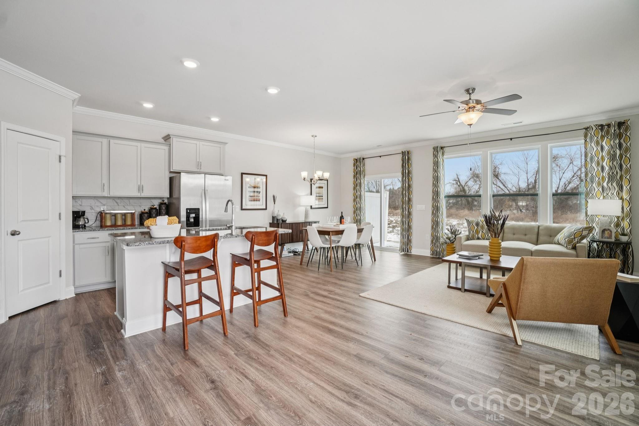 362 Lagoon Road Fletcher, NC 28732 - Photo 6 of 34 a living room with furniture dining table and a large window