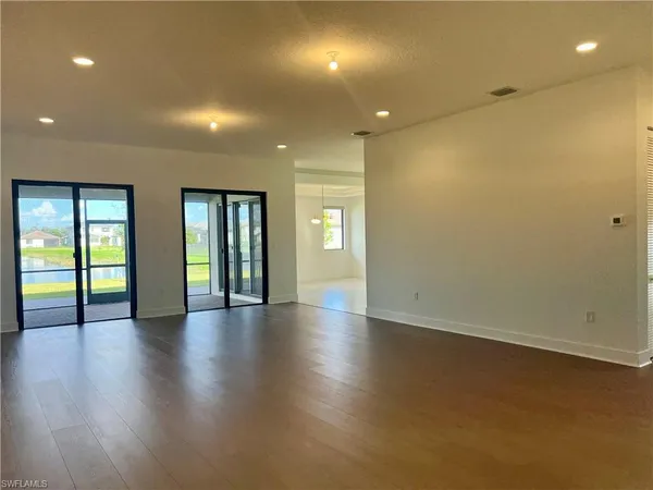 an empty room with wooden floor
