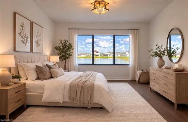 a kitchen with stainless steel appliances granite countertop a refrigerator a sink a stove and a refrigerator