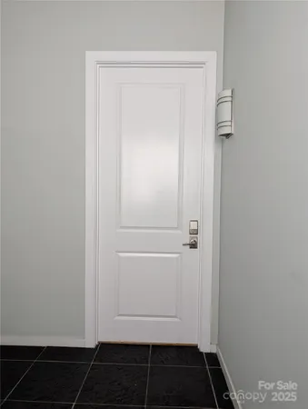 a car parked in front of a brick building