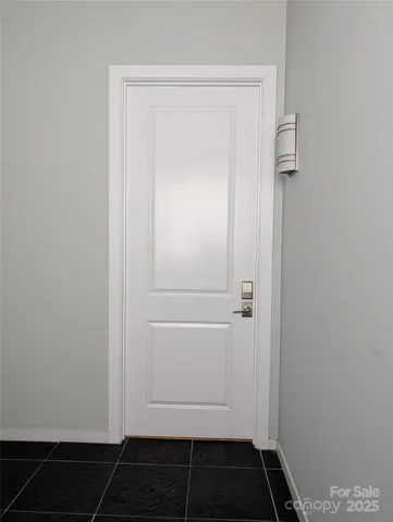 a car parked in front of a brick building