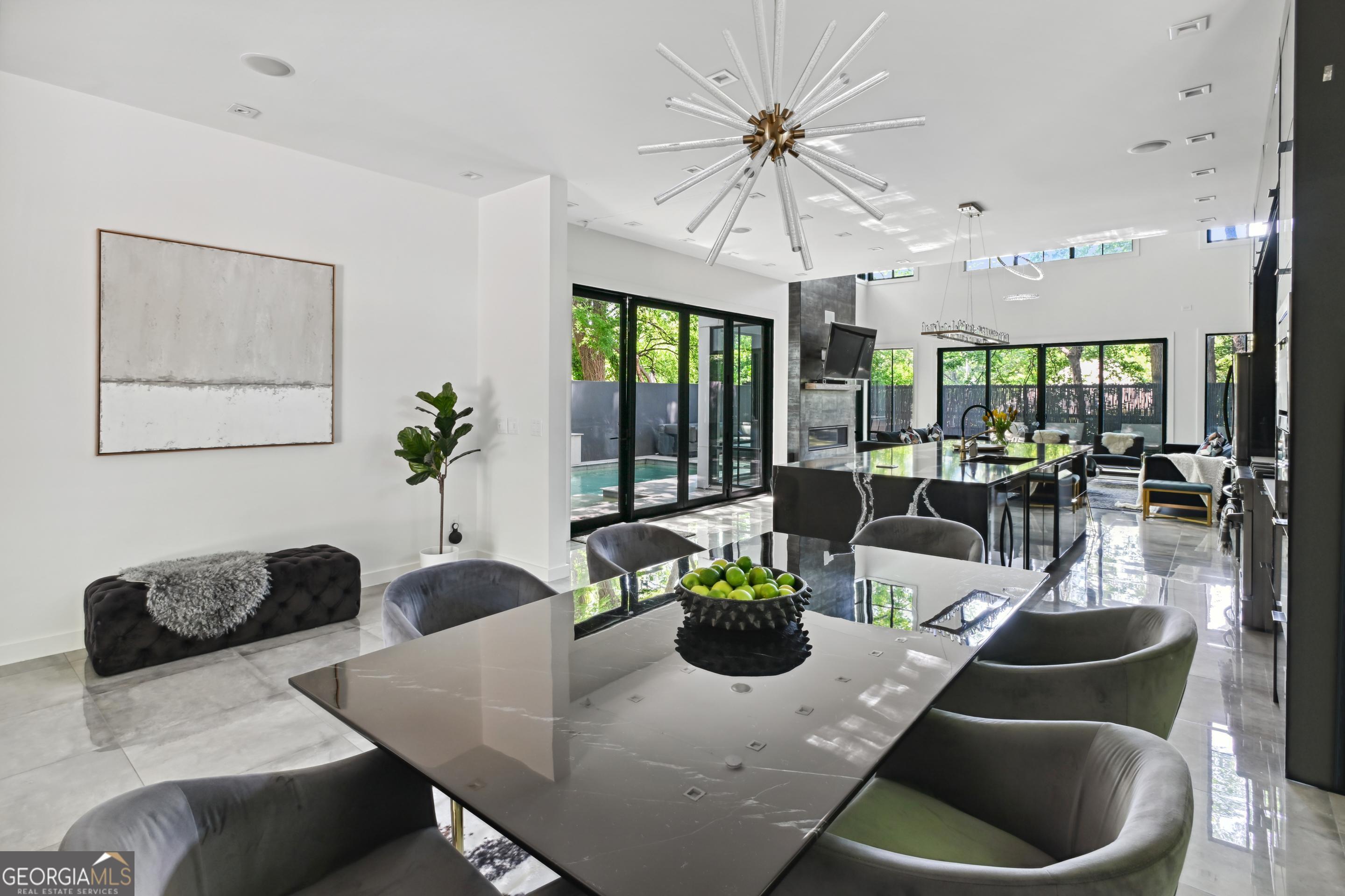818 Verner Street Northwest Atlanta, GA 30318 - Photo 13 of 47 a living room with furniture potted plant and a large window